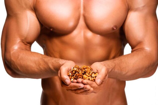 Man holding walnuts for potency