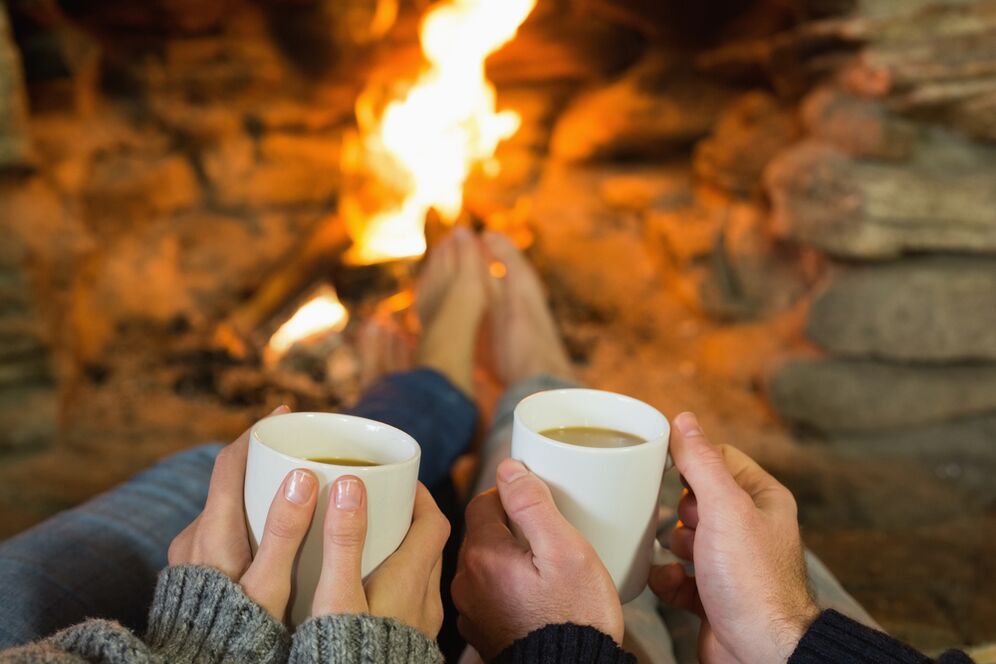 The couple in front of the campfire